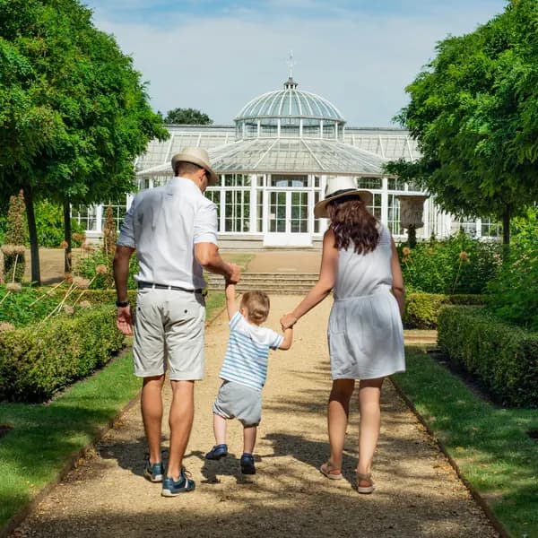 Family walking in a garden