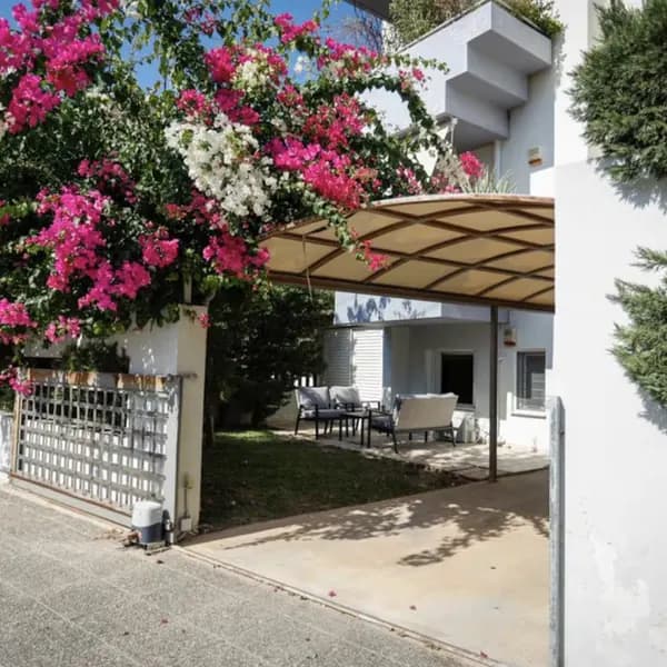 Carport under bougainvillea